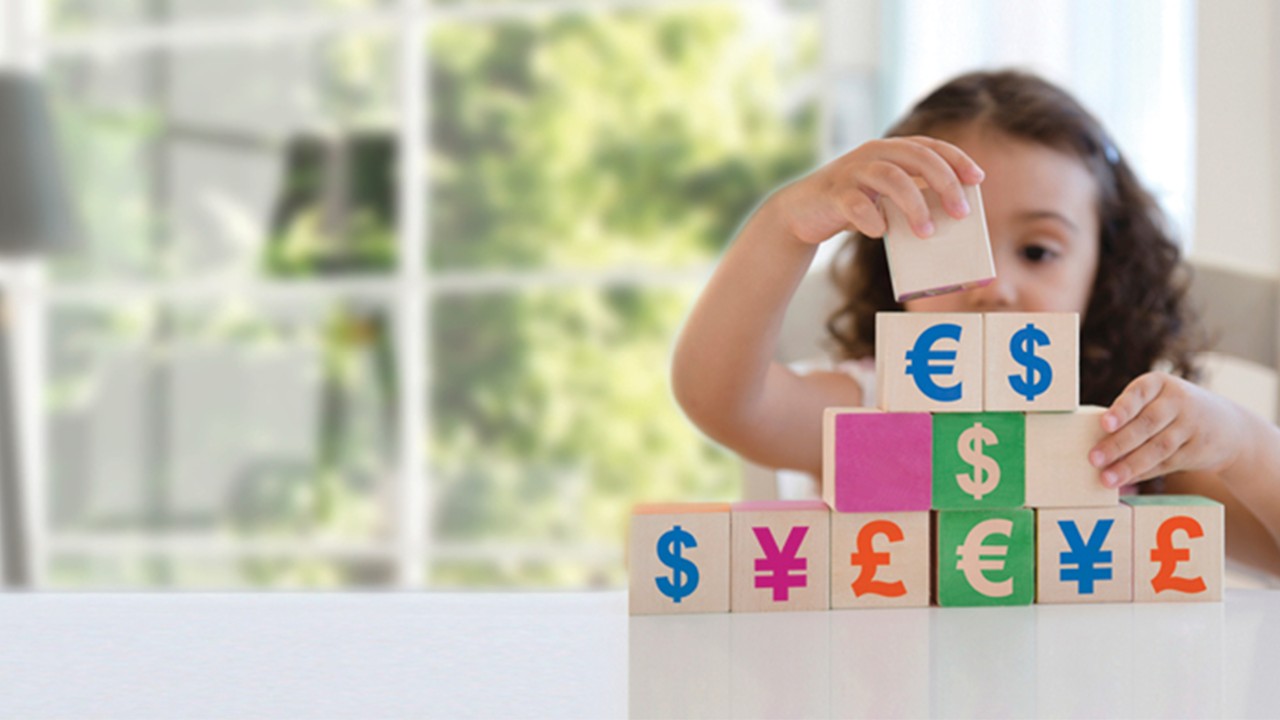 a girl is playing blocks; image used for HSBC Mauritius Foreign Currency Account page.